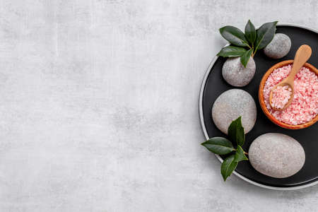 Beauty treatment massage with spa stonea and pink sea salt, top view