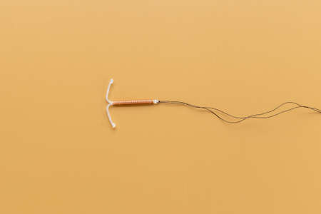 T-shaped intrauterine contraceptive device. Hormone free contraception conceptの写真素材