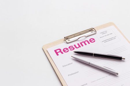Searhing for a new job. Resume application form on office table