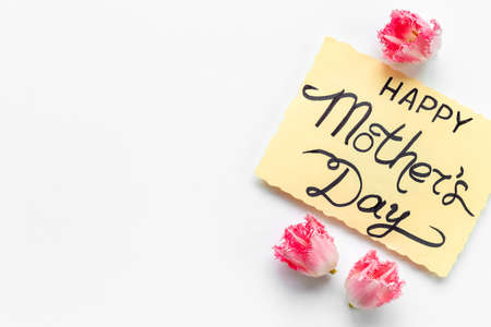 Happy Mothers day background with pink flowers, top view