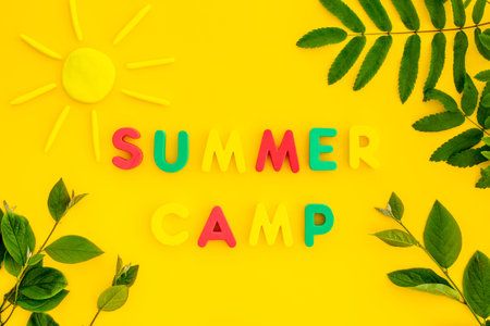 Summer hike concept. Text Summer Camp with green tree branches