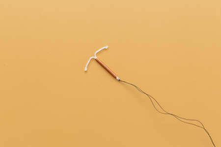 T-shaped intrauterine contraceptive device. Hormone free contraception conceptの写真素材