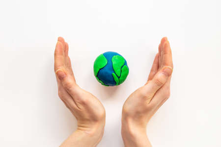 Modeling clay world in hands. Earth Day conceptの写真素材