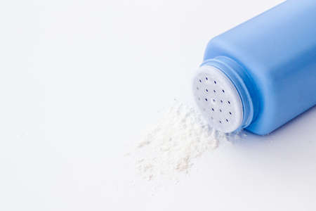 Talcum powder in container. Spilled white powderの写真素材