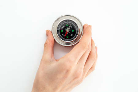 Compass in businessmans hand. Business navigates recovery conceptの写真素材