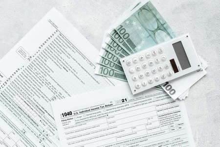 Annual tax form under US law with culculator. Tax payment conceptの写真素材
