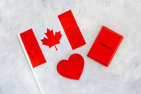 Flag of Canada with passport. Travel visa and citizenship conceptの写真素材