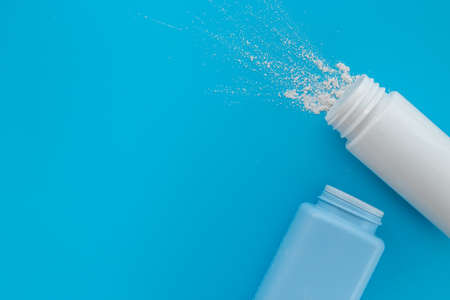 Spilled white talcum powder in container. Skin care cosmeticの写真素材