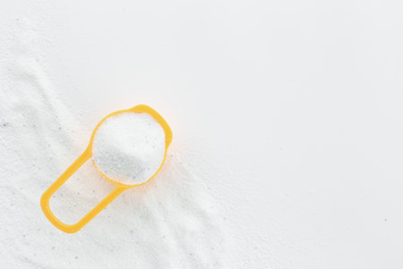 White laundry detergents powder with cup for laundryの写真素材