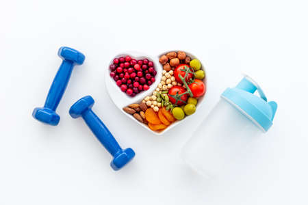 Sports nutrition diet. Healthy food with fitness equipmentの写真素材