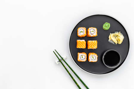 Sushi menu concept. Sushi roll set with salmon on dishの写真素材