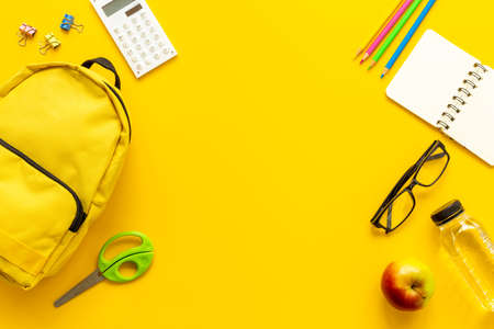 Educational objects top view. School backpack with colorful stationeryの写真素材