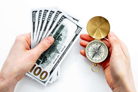 Hand holding compass. Best solution or direction conceptの写真素材