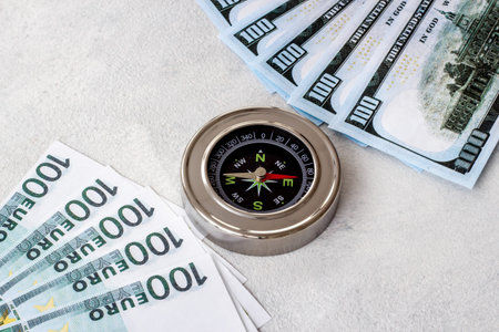 Compass and money cash - exchange rate change concept