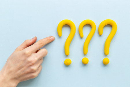 Hand with question mark symbol. FAQ and help concept