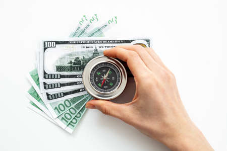Compass in businessmans hand. Business navigates recovery conceptの写真素材