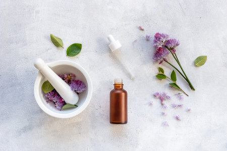 Cosmetic bottle with pipette and medicinal herbs essential oil