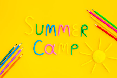 Summer Camp made of color clay with sun. Camping background