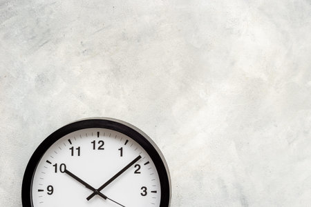 Black and white clock. Round wall clock - time to work conceptの写真素材