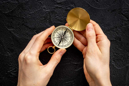 Hand holding compass. Best solution or direction conceptの写真素材