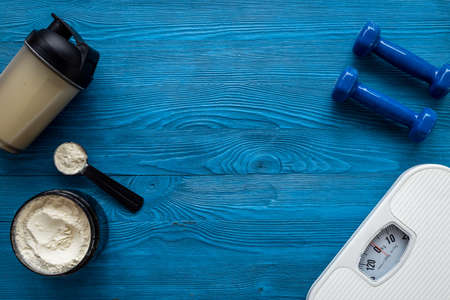 Fitness and gym diet concept. Whey protein in jar and shakerの写真素材