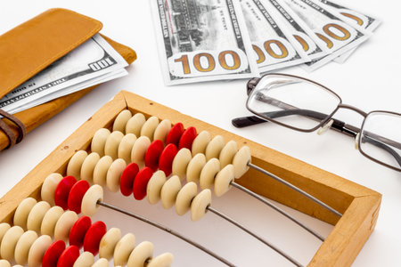Vintage accounting wooden abacus with wallet. Personal finance conceptの写真素材