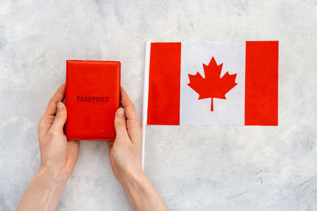 Flag of Canada with passport. Travel visa and citizenship conceptの写真素材