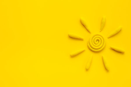 Weather forecast concept with Plasticine sun, top viewの写真素材