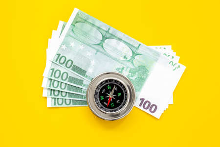 Compass and money cash. Exchange quotes of currencies conceptの写真素材