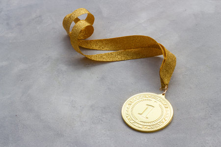 Winner or champion gold trophy - medal first place on ribbon