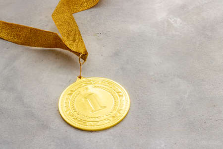 Winner or champion gold trophy - medal first place on ribbonの写真素材