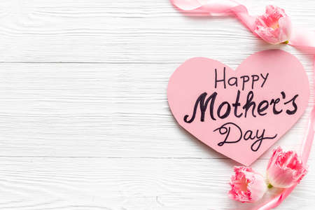 Layout of Happy Mothers day greeting card and pink flowers, top viewの写真素材