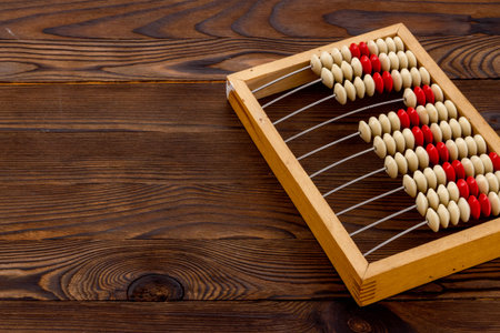 Vintage accounting wooden abacus. Financial calculations concept