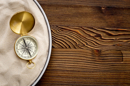 Compass in the sand. Best solution or direction conceptの写真素材