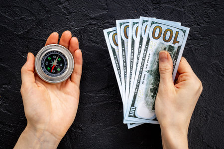 Compass in businessmans hand. Business navigates recovery concept
