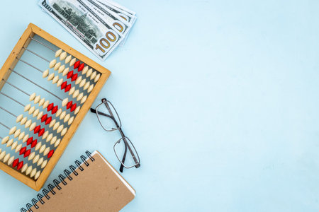 Vintage accounting wooden abacus. Financial calculations concept