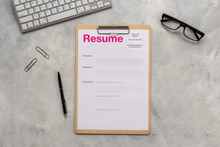 Searhing for a new job. Resume application form on office table