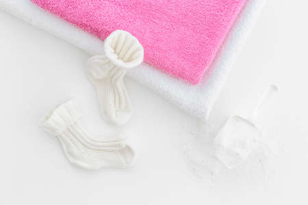 Flatlay of laundry detergents powder with fresh towelsの写真素材