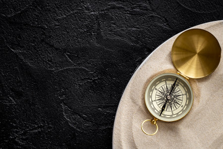 Compass in the sand. Business navigates recovery conceptの写真素材