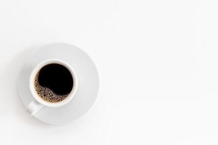 White cup of hot black coffee top view. Coffee break time conceptの写真素材
