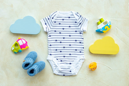 Baby infant cotton clothes with kids accessories, flat layの写真素材