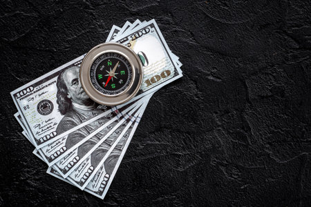 Compass and money cash. Exchange quotes of currencies conceptの写真素材