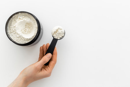 Sports nutrition. Whey protein powder in jar. Fitness and gym dietの写真素材