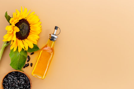 Yellow sunflowers with cooking oil and black seeds. Food backgroundの写真素材