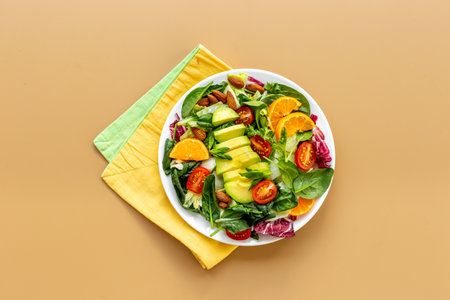 Bowl of green salad with avocado and tomatoes. Healthy vegetarian lanchの写真素材