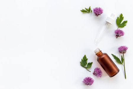 Cosmetic bottle with pipette and medicinal herbs essential oilの写真素材