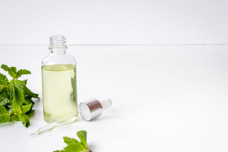 Mint leaves with aroma essential peppermint oilの写真素材