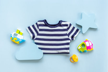 Baby boy newborn bodysuit with toys and accessories, flat layの写真素材