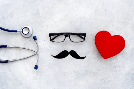 Black glasses with a mustache and stethoscope. Mans health conceptの写真素材