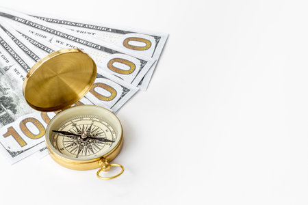 Compass and money cash. Exchange quotes of currencies conceptの写真素材